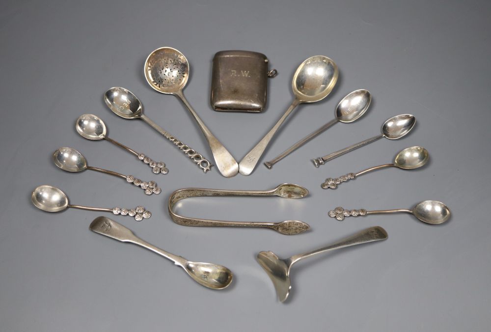 A George V silver vesta case and thirteen pieces of cutlery including eight silver.